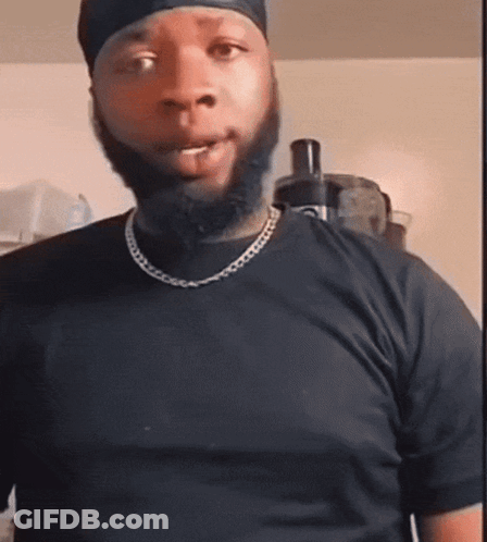 Bearded Man In Black T-Shirt With Chain GIF