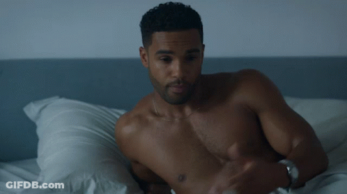 Bearded Man In Black Tank Top Eyes Closed Looking Down GIF