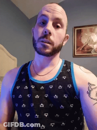 Bearded Man In Black Triangle Tank Top GIF
