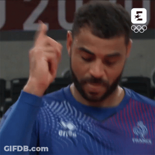Bearded Man In Blue And Red Shirt Giving Middle Finger GIF