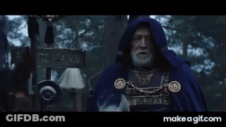 Bearded Man In Blue Cape In Snowy Woods GIF