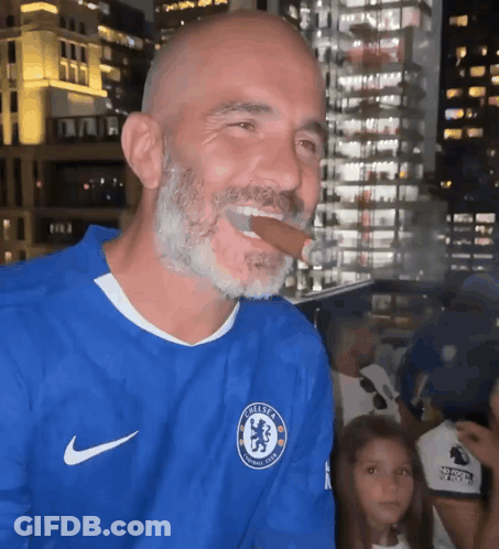 Bearded Man In Blue Chelsea Jersey Smoking Cigar GIF