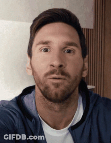 Bearded Man In Blue Jacket Looking At Camera GIF