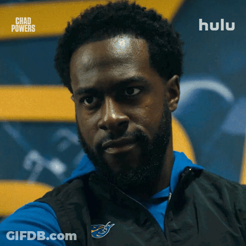 Bearded Man In Blue Shirt And Black Vest Saying Hulu GIF