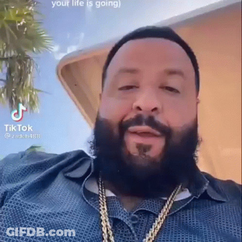 Bearded Man In Blue Shirt And Gold Chains GIF