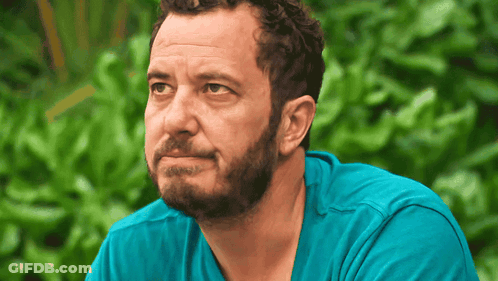Bearded Man In Blue Shirt Looking To Side GIF