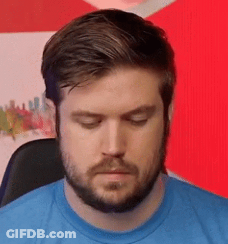 Bearded Man In Blue Shirt Making Funny Face GIF