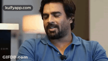 Bearded Man In Blue Shirt With Microphone GIF