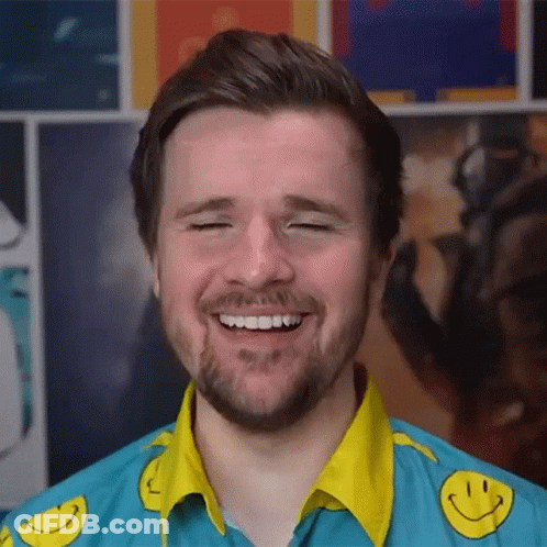 Bearded Man In Blue Shirt With Yellow Smiley Faces GIF