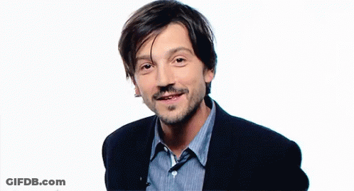 Bearded Man In Blue Striped Shirt Making Peace Sign GIF