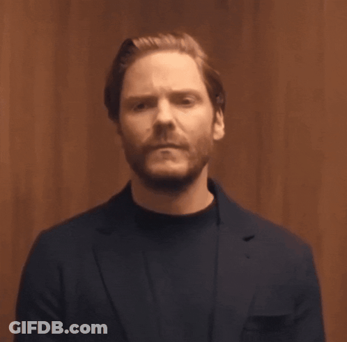 Bearded Man In Blue Suit And Black Sweater GIF