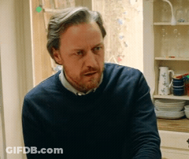 Bearded Man In Blue Sweater At Window GIF
