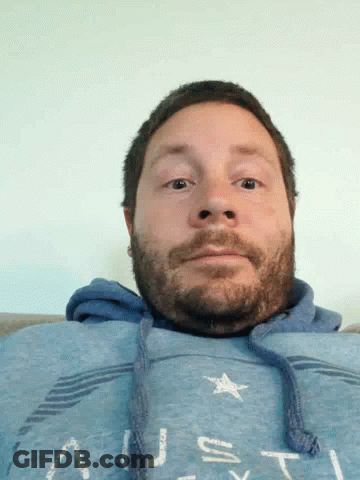 Bearded Man In Blue Sweatshirt Saying Us GIF