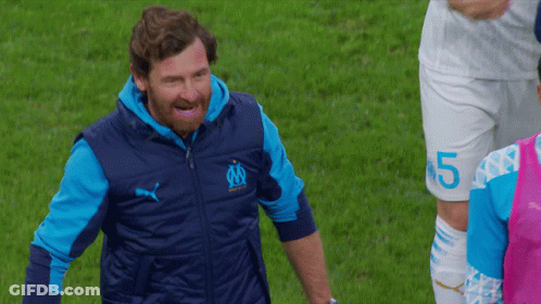 Bearded Man In Blue Vest With Letter M GIF