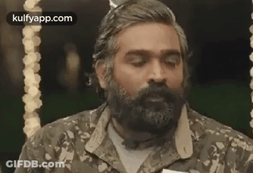 Bearded Man In Camo Shirt And Bow Tie GIF