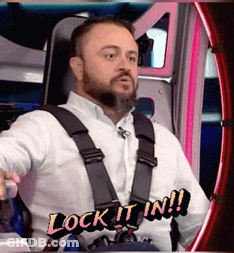 Bearded Man In Chair With White Shirt And Seat Belt GIF