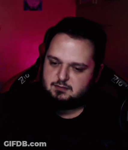 Bearded Man In Chair With Z On Back GIF
