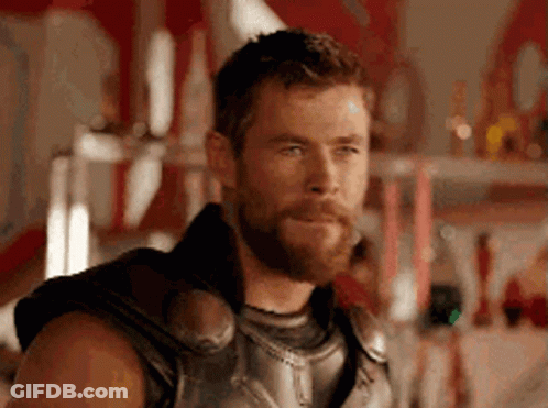 Bearded Man In Costume Looking At Camera GIF