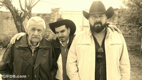 Bearded Man In Cowboy Hat With Two Men GIF