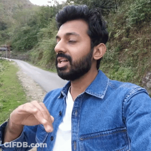 Bearded Man In Denim Jacket And White Shirt GIF