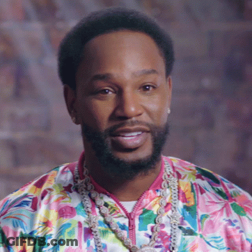 Bearded Man In Floral Shirt And Necklace GIF