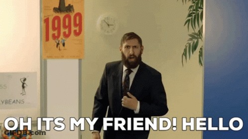 Bearded Man In Front Of 1999 Sign GIF