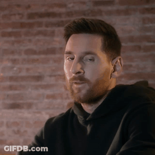 Bearded Man In Front Of Brick Wall GIF