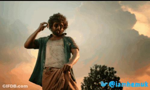 Bearded Man In Front Of Cloudy Sky And Twitter Logo GIF