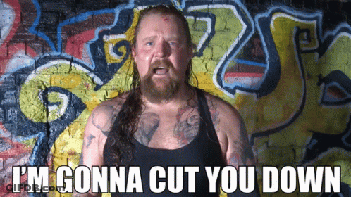 Bearded Man In Front Of Graffiti I'm Gonna Cut You Down GIF
