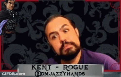 Bearded Man In Front Of Kent Rogue Banner GIF
