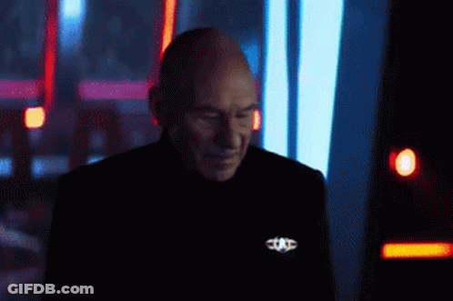 Bearded Man In Front Of Screen With T GIF