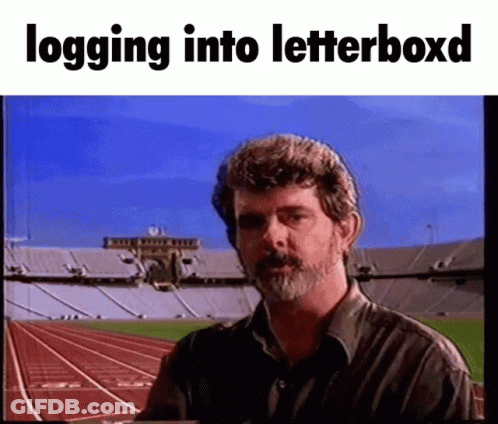 Bearded Man In Front Of Stadium Logging Into Letterboxd GIF