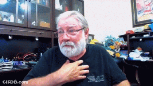 Bearded Man In Glasses And Black Evo Shirt GIF