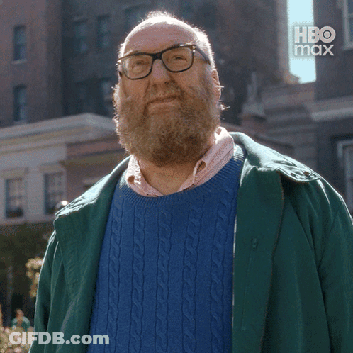 Bearded Man In Glasses And Blue Sweater Saying Maybe GIF