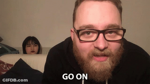 Bearded Man In Glasses Tells Woman Go On GIF