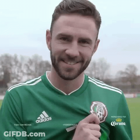 Bearded Man In Green Adidas Shirt Holding Trophy GIF