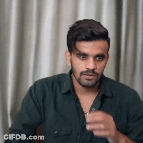 Bearded Man In Green Shirt And Necklace GIF