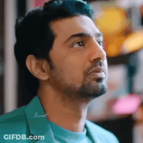 Bearded Man In Green Shirt Looking Up GIF