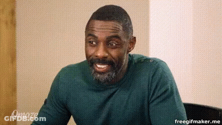 Bearded Man In Green Sweater Smiling In Chair GIF