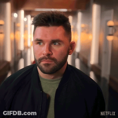 Bearded Man In Hallway With Netflix Logo GIF