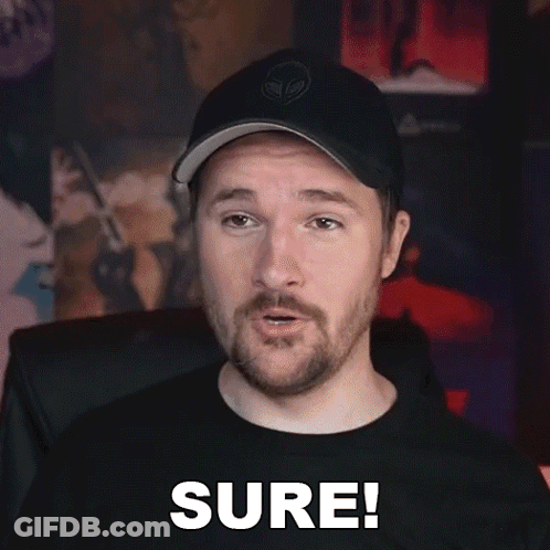 Bearded Man In Hat And Black Shirt Saying Sure GIF