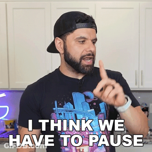 Bearded Man In Hat And Black Shirt Says I Think We Have To Pause GIF