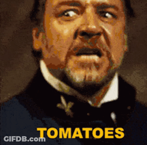Bearded Man In Hat And Bow Tie At Window GIF