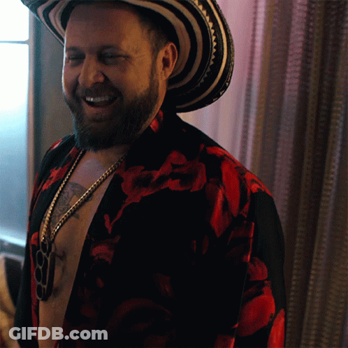 Bearded Man In Hat And Floral Shirt Smiling GIF