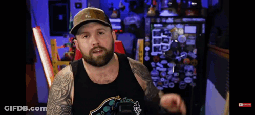 Bearded Man In Hat And Fox Tank Top GIF