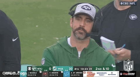 Bearded Man In Hat And Headphones Watching Football On CBS GIF