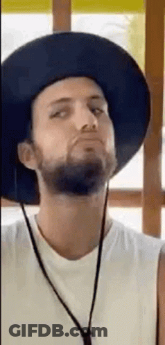 Bearded Man In Hat And Necklace Making Funny Face GIF