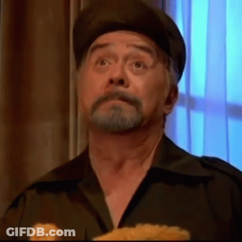Bearded Man In Hat Holding Stuffed Animal GIF