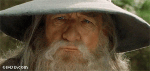 Bearded Man In Hat Looking At Camera GIF