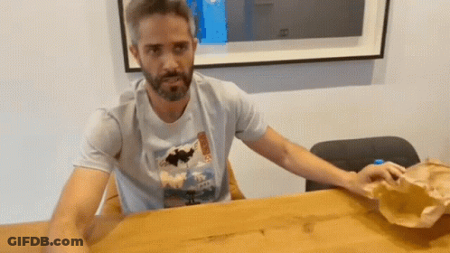 Bearded Man In Hawaii T-Shirt At Table GIF